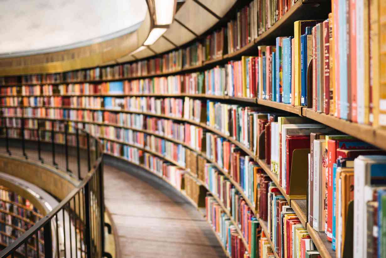 Curved library bookshelf wall